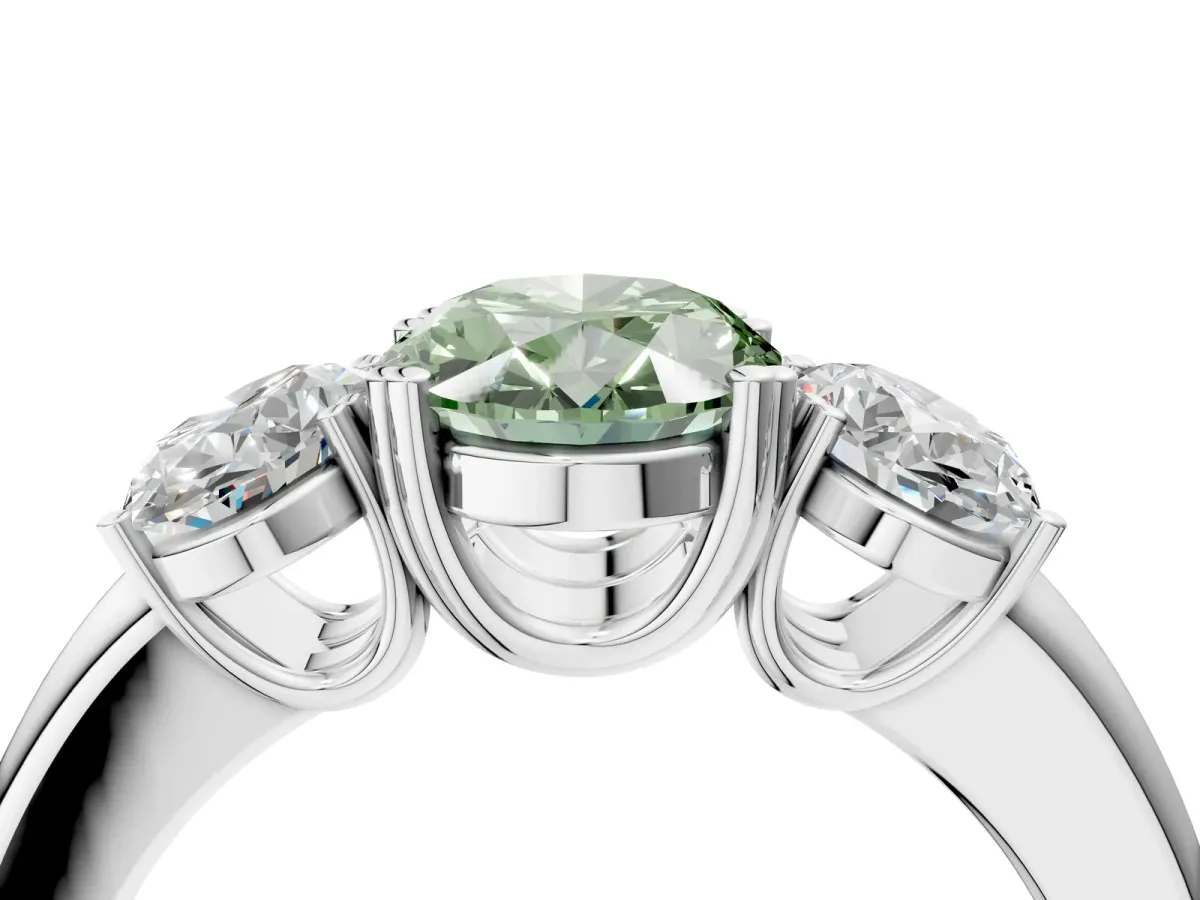 Fancy Green Three-Stone Oval Cut Cut Diamond Ring with Channel Set Band and Four-Prong Setting Platinum