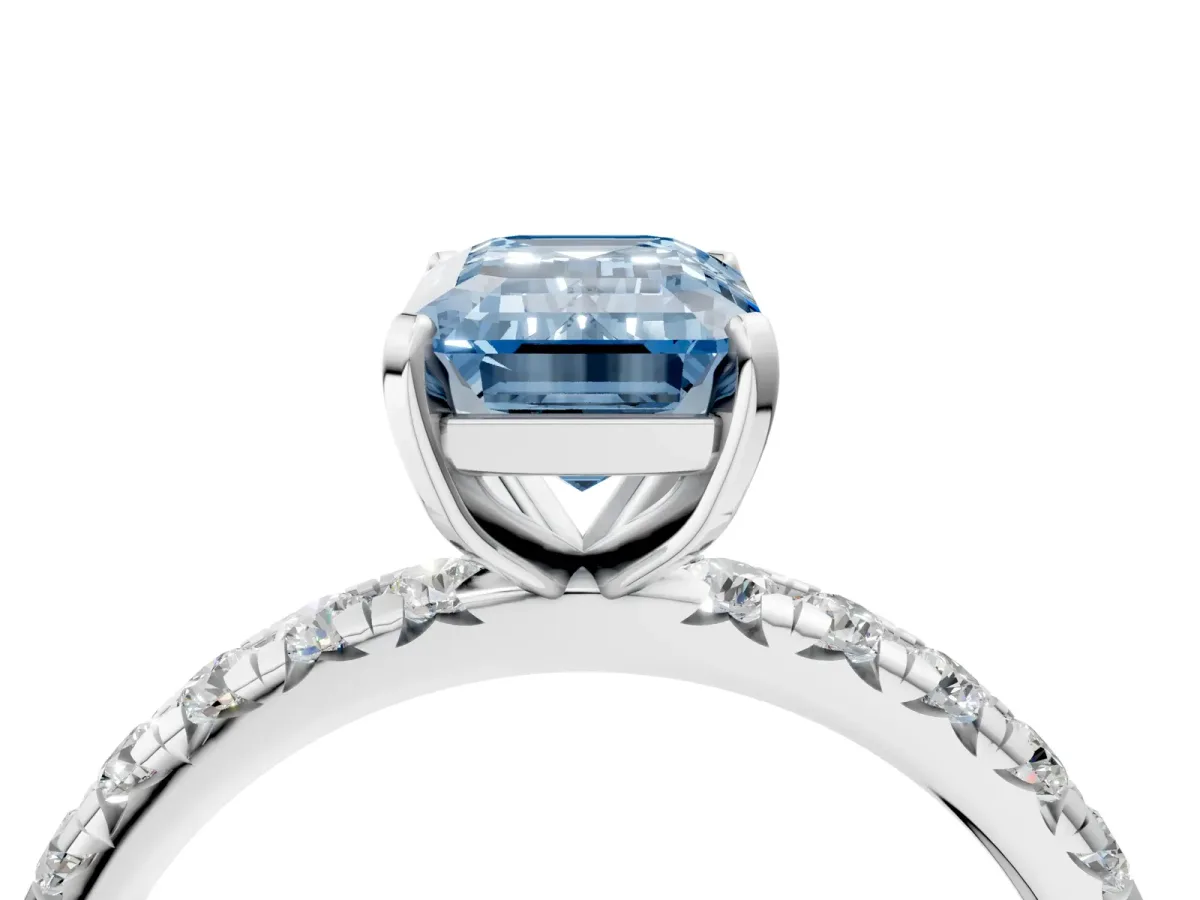 Fancy Blue Emerald Cut Diamond Pavé Solitaire Ring with Round Band and Prong Setting White gold