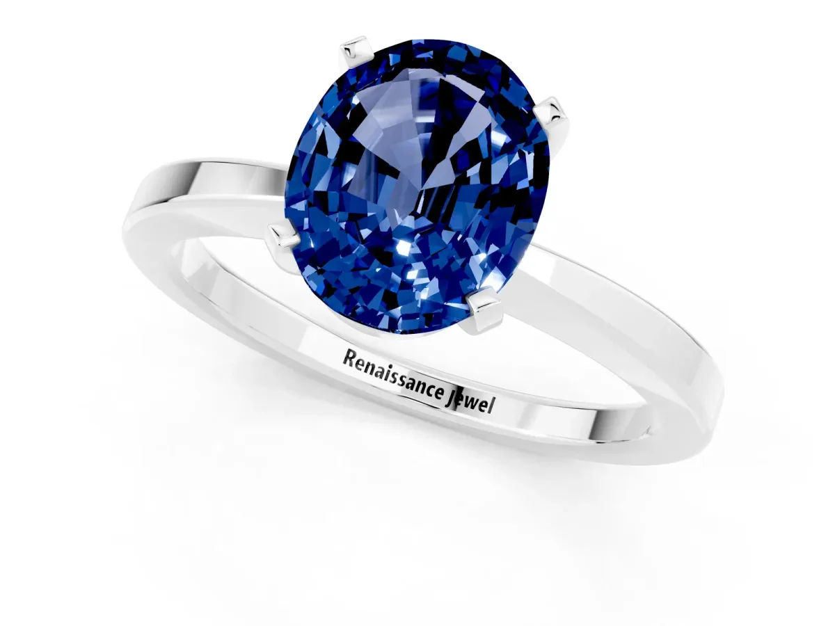 Oval Cut Blue Sapphire Solitaire Engagement Ring with Classic Band and Four-Prong Setting Silver