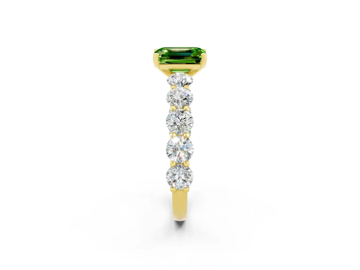Emerald Cut Peridot Prong Setting with Side Stones on a Pave Band Yellow gold