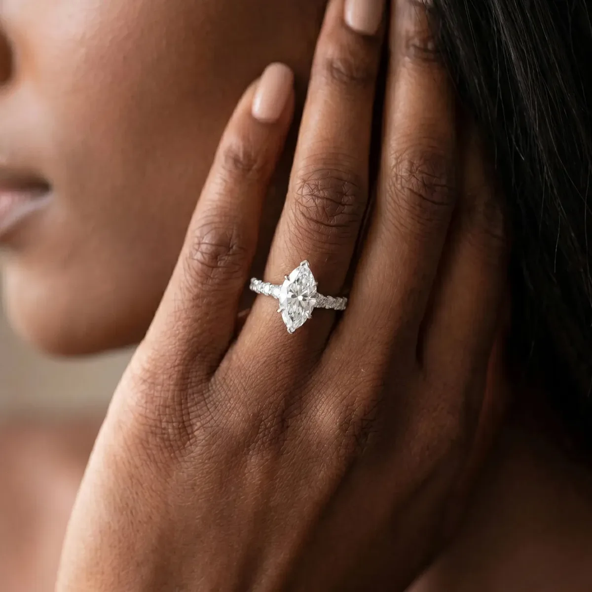 Marquise Cut Diamond Side Stone Solitaire Ring with Round and Four-Prong Setting Silver