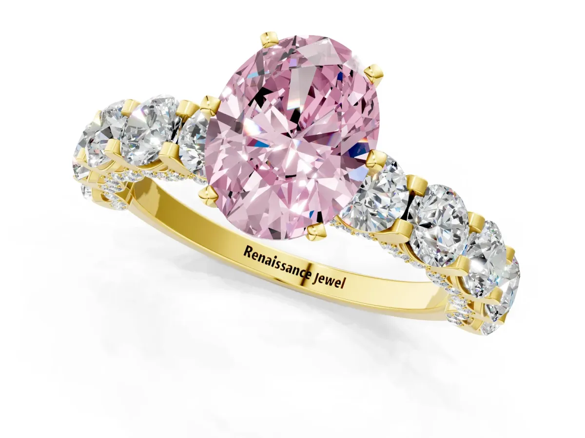 Fancy Pink Oval Cut Diamond Side Stone Engagement Ring with Four-Prong Setting Yellow gold
