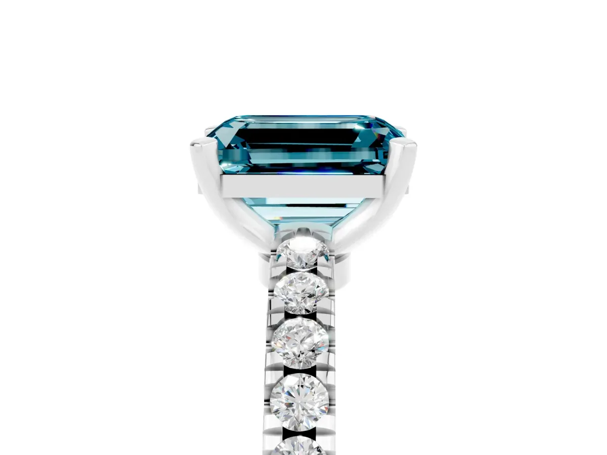 Emerald Cut Solitaire Blue Topaz with Pavé Band and Four-Prong Setting Platinum