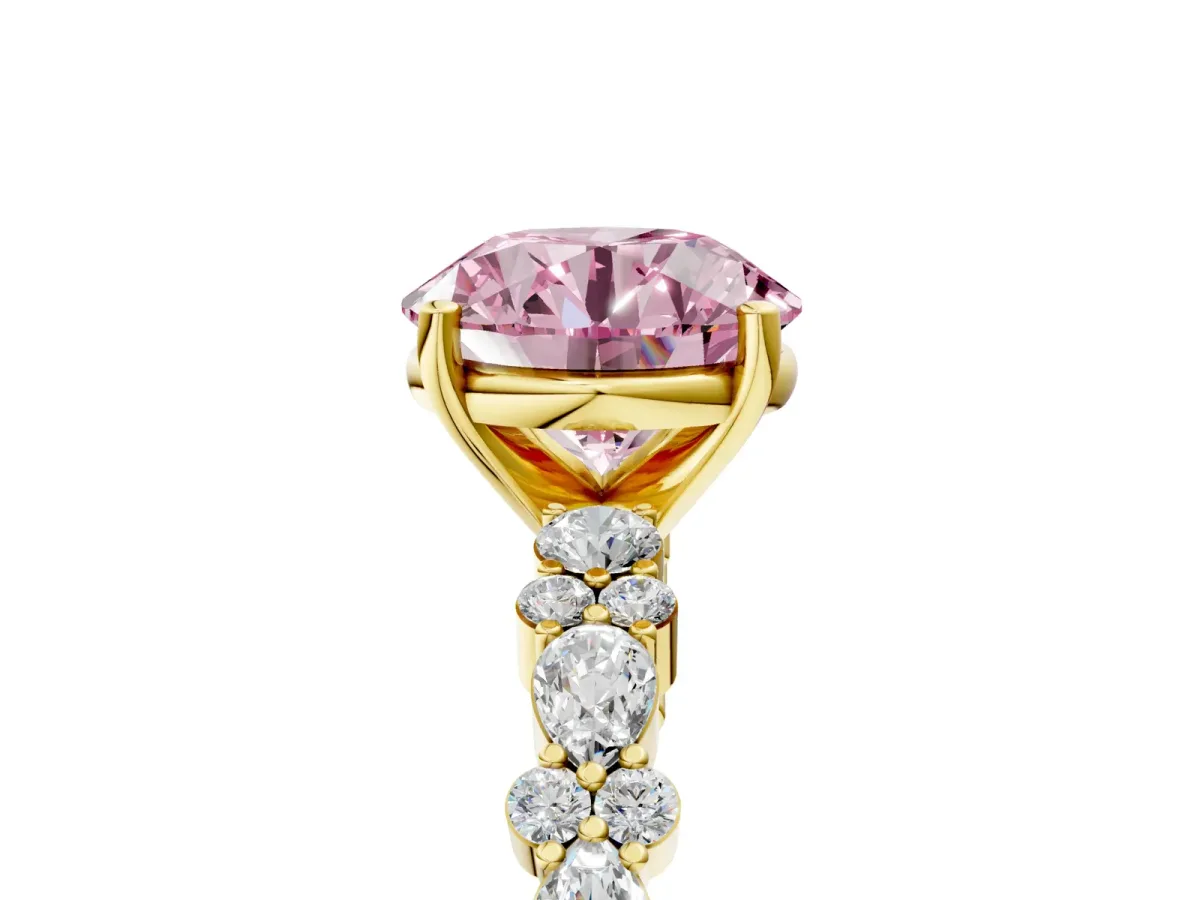 Fancy Pink Round Cut Diamond Side Stone Solitaire Ring with Round and Four-Prong Setting Yellow gold