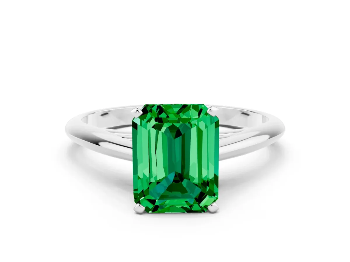 Emerald Cut Emerald Solitaire Engagement Ring with Cathedral Setting and Four-Prong Mount White gold