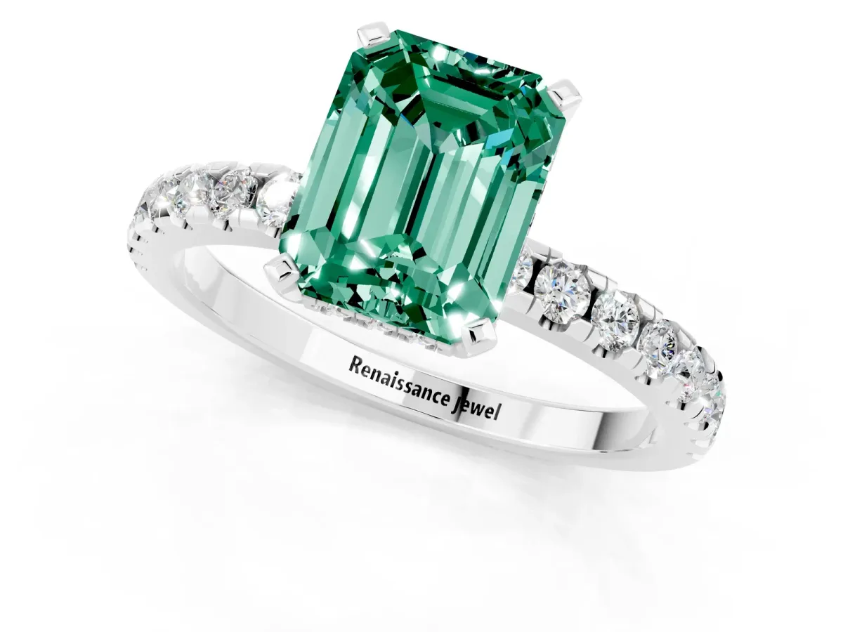 Emerald Cut Green Sapphire Solitaire Ring with Round Pavé Band and Four-Prong Setting Silver