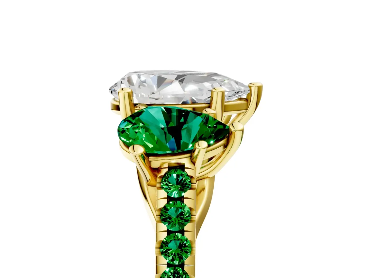 Three-Stone Pear Cut Diamond Ring with Round Emerald Pavé Band and Prong Setting Yellow gold