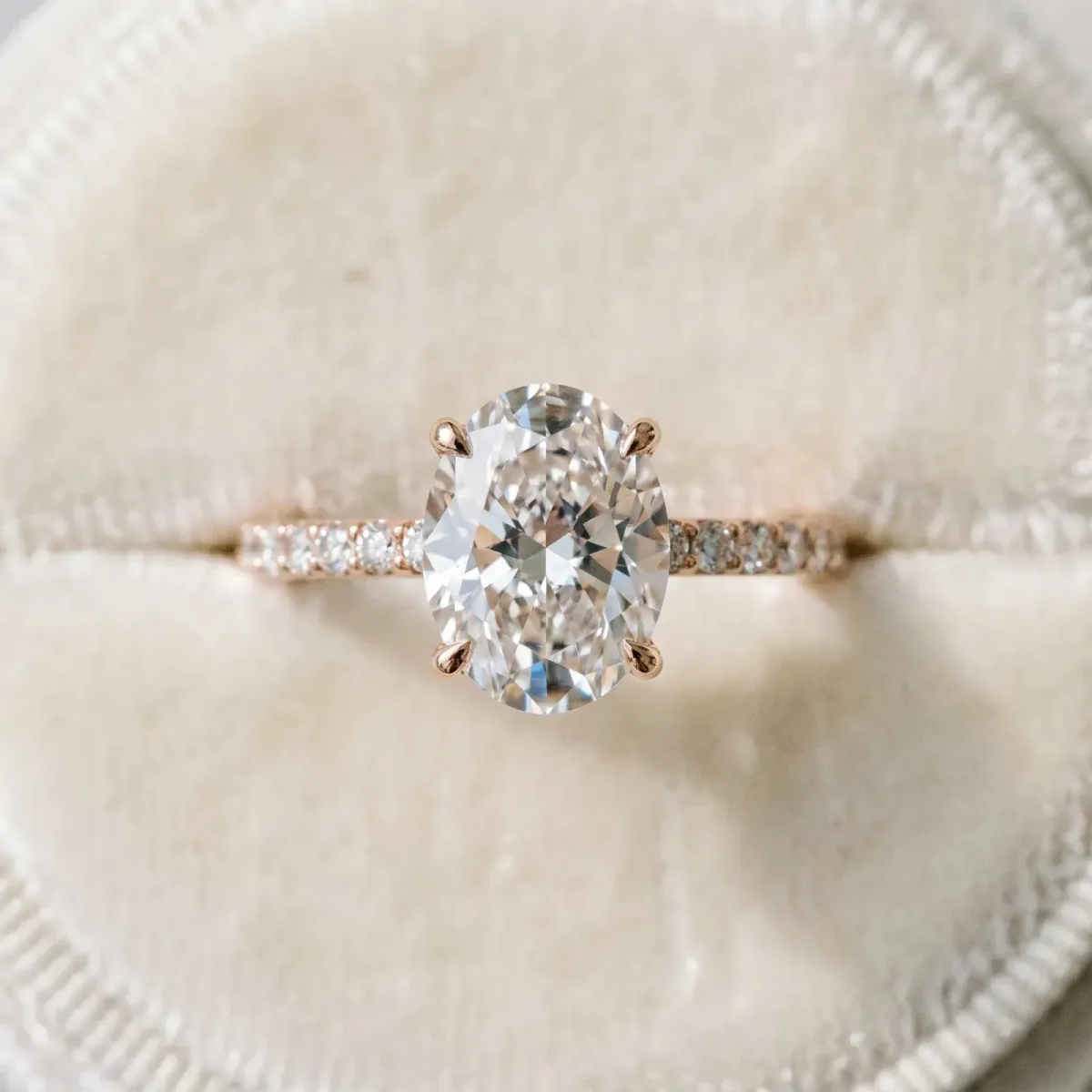 Oval Cut Diamond Solitaire Ring with Round Pavé Band and Prong Setting Rose gold