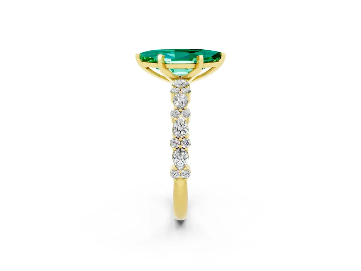 Marquise Cut Emerald Side Stone Solitaire Ring with Round and Four-Prong Setting Yellow gold