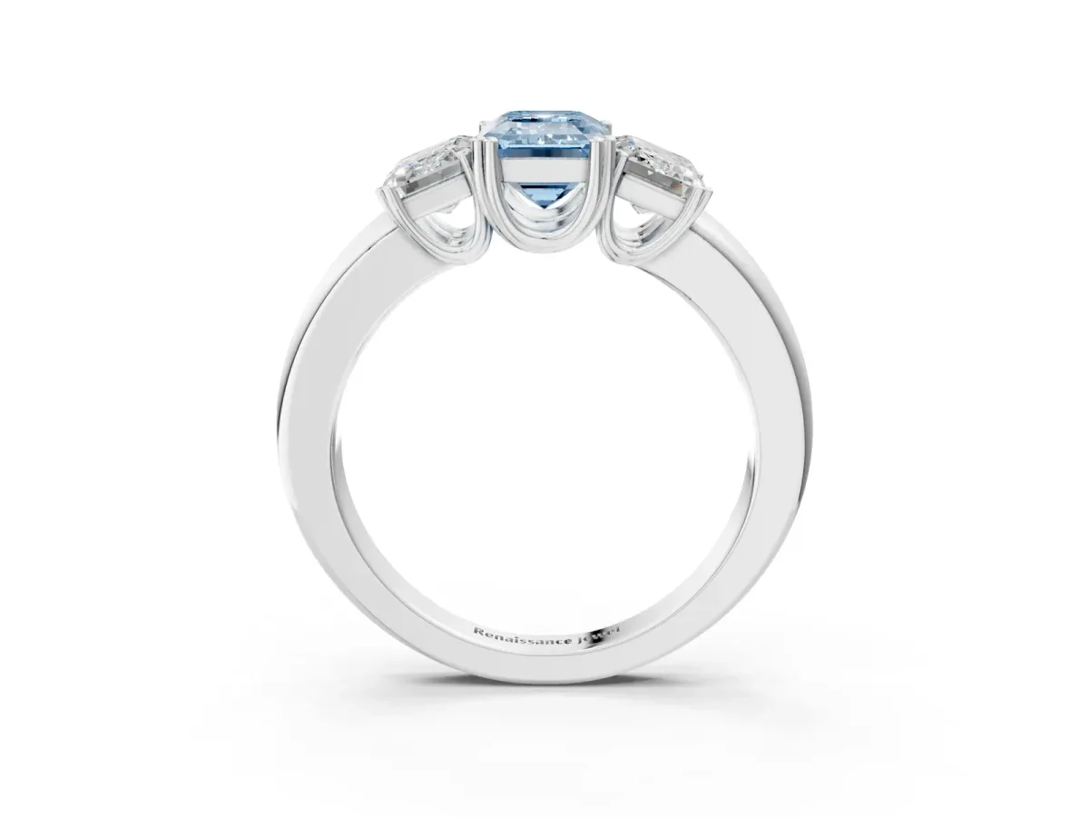 Fancy Blue Three-Stone Emerald Cut Cut Diamond Ring with Channel Set Band and Four-Prong Setting Silver