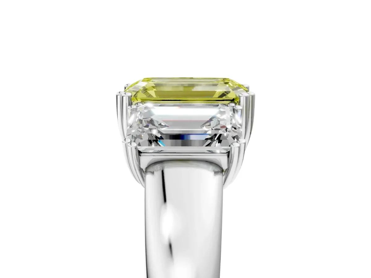 Fancy Yellow Three-Stone Emerald Cut Cut Diamond Ring with Channel Set Band and Four-Prong Setting Silver