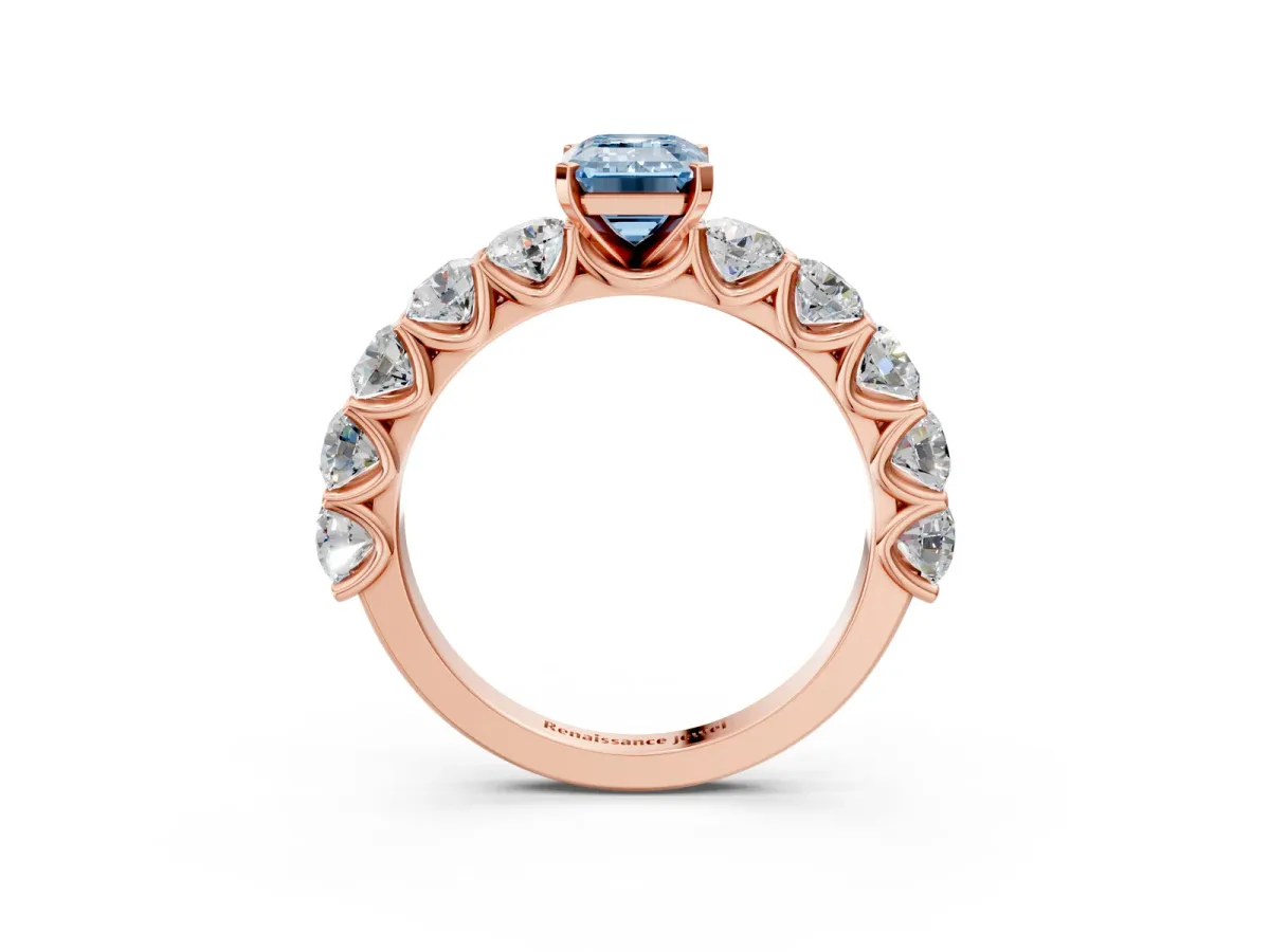 Fancy Blue Emerald Cut Diamond Prong Setting with Side Stones on a Pave Band Rose gold