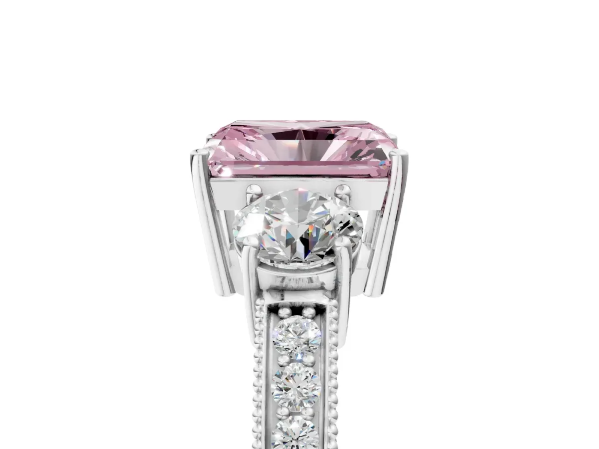 Fancy Pink Radiant Cut Three-Stone Diamond Ring with Pavé Band and Four-Prong Setting Platinum