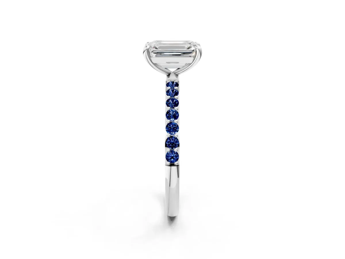 Emerald Cut Diamond Solitaire Ring with Round Blue Sapphire Pavé Band and Prong Setting Silver