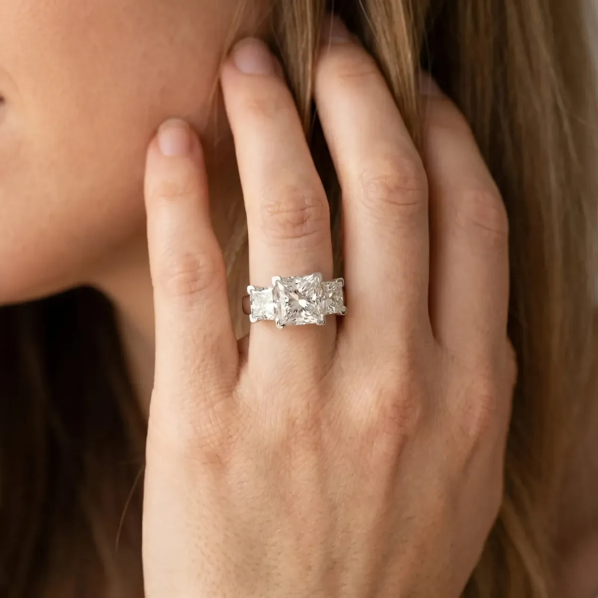 Three-Stone Radiant Cut Cut Diamond Ring with Channel Set Band and Four-Prong Setting Silver