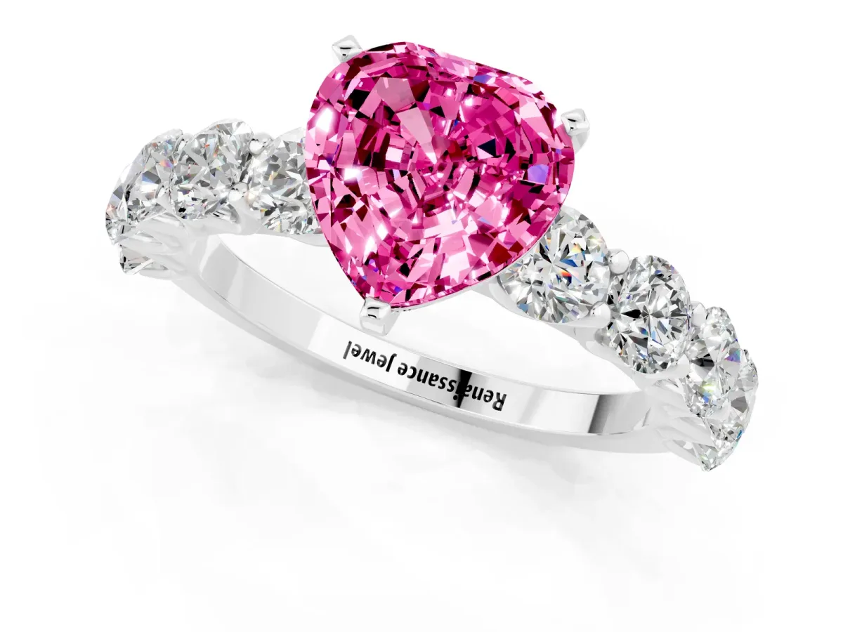 Heart Cut Pink Sapphire Prong Setting with Side Stones on a Pave Band Silver