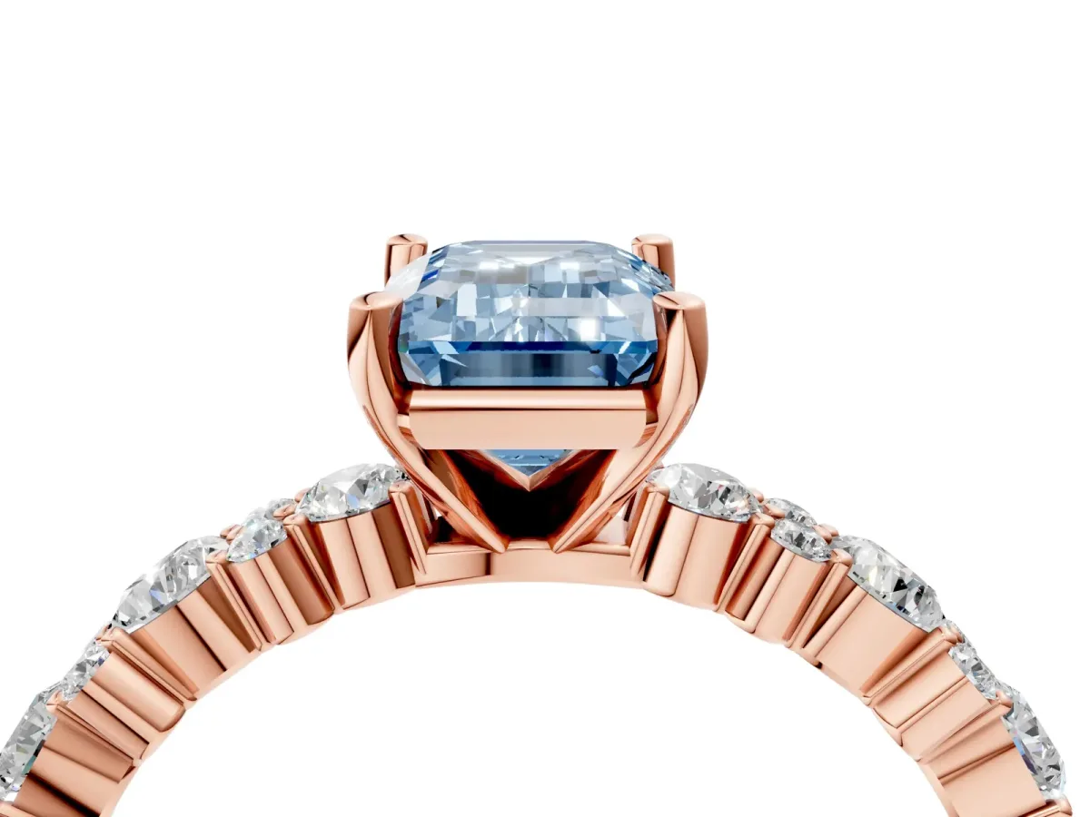 Fancy Blue Emerald Cut Diamond Side Stone Solitaire Ring with Round and Four-Prong Setting Rose gold