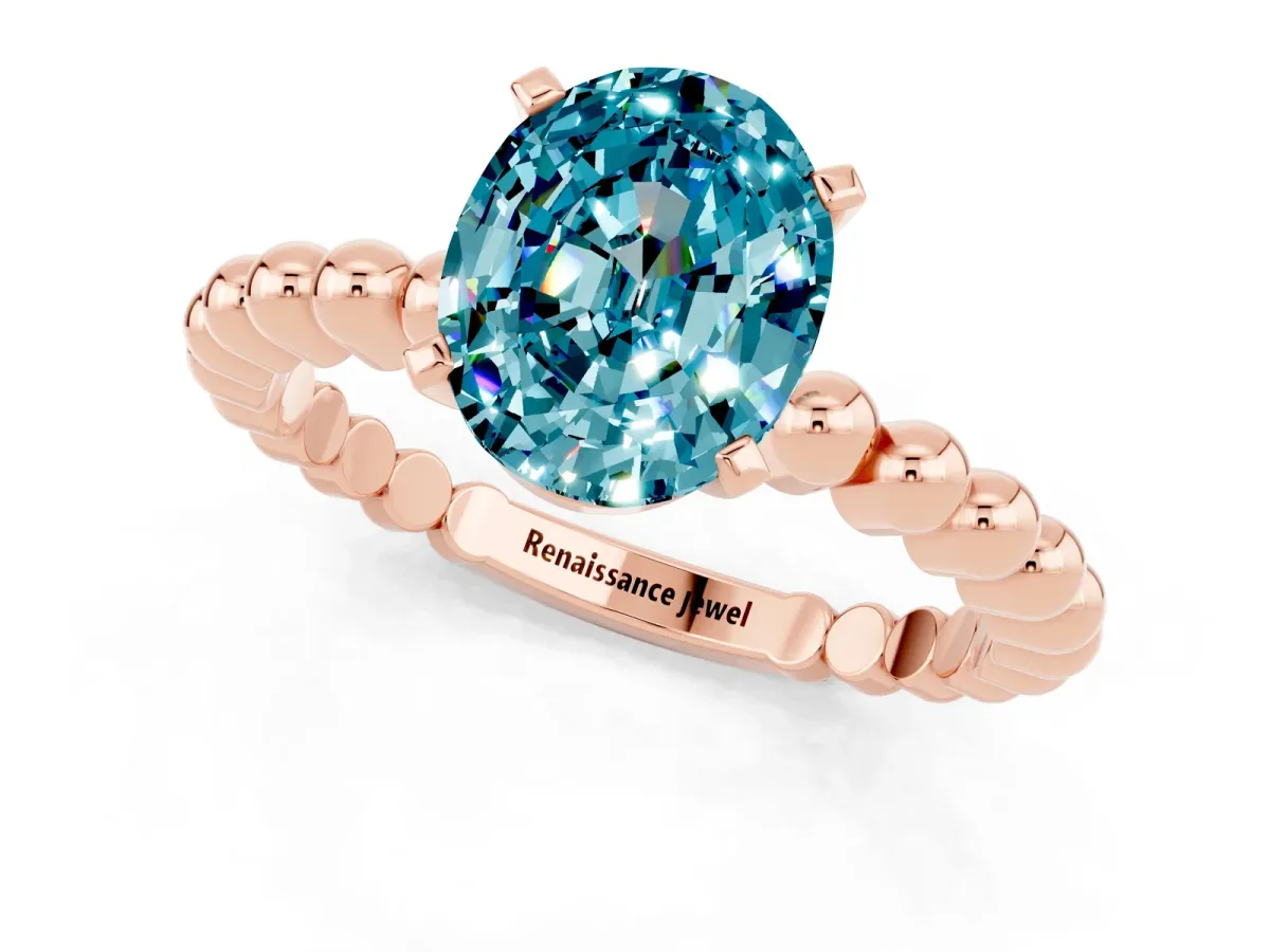 Oval Cut Blue Topaz Solitaire Ring with Beaded Band and Prong Setting Rose gold