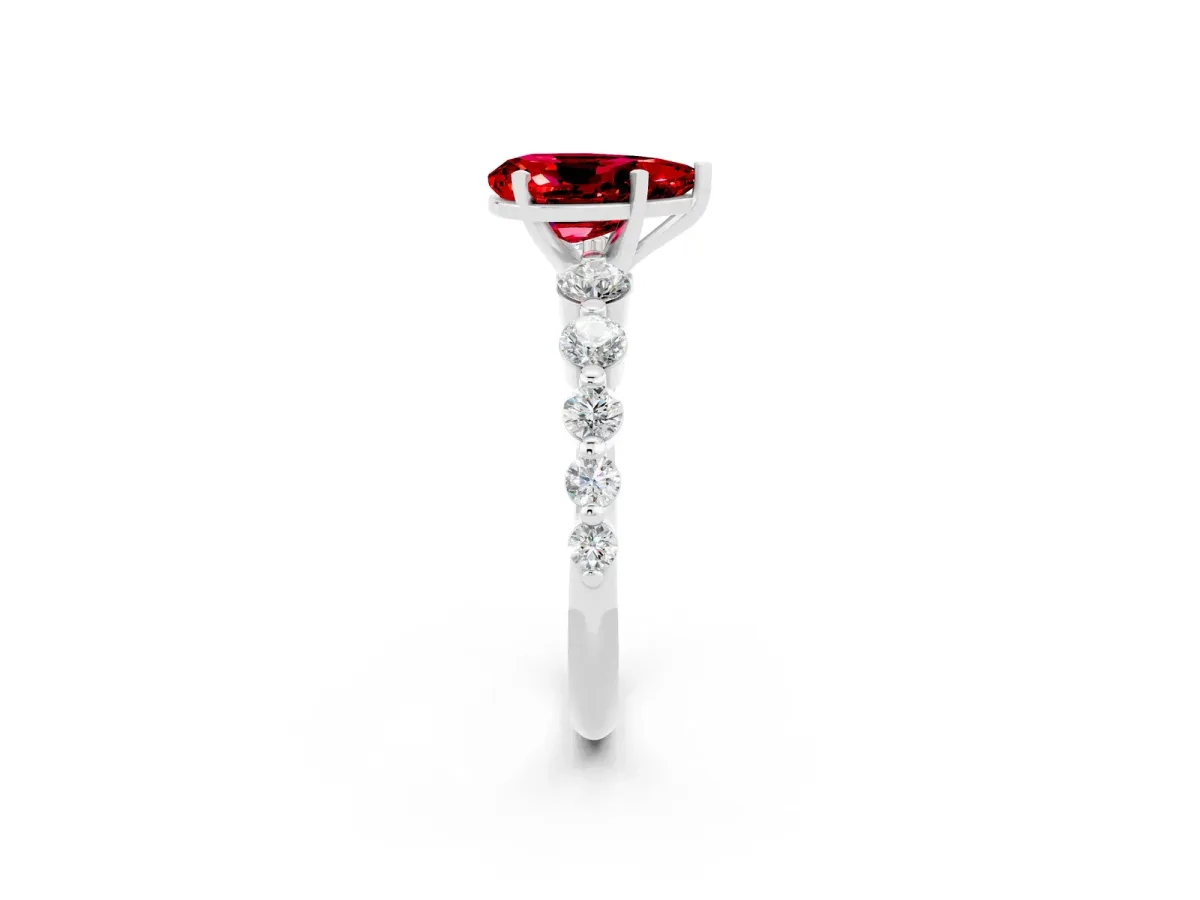 Pear Cut Solitaire Ruby Ring with Pave Band and Four-Prong Setting Silver