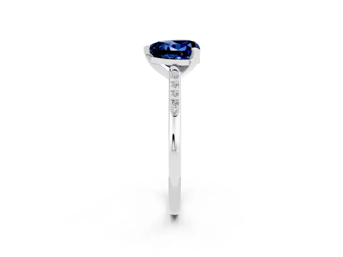 Heart Cut Blue Sapphire Solitaire Ring with Channel Set Round Band and Prong Setting Silver
