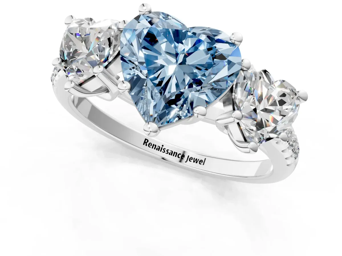 Fancy Blue Three-Stone Heart Cut Diamond Ring with Round Pavé Band and Prong Setting Silver