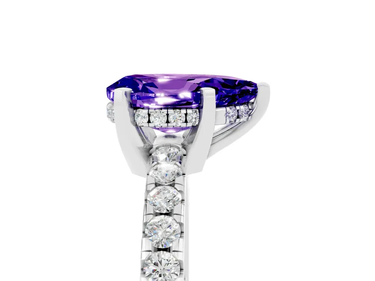 Pear Cut Tanzanite Solitaire Ring with Round Pavé Band and Four-Prong Setting Silver
