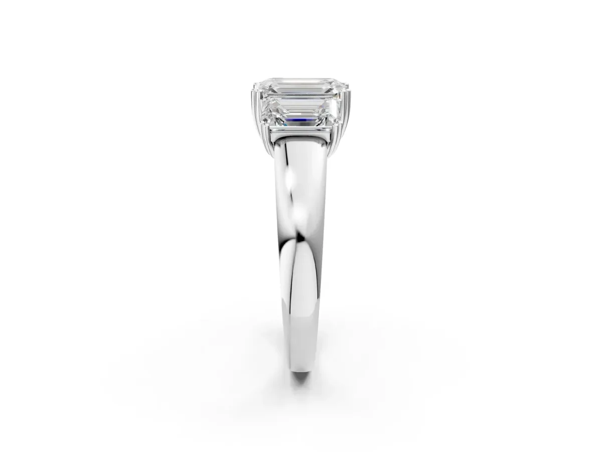 Three-Stone Emerald Cut Cut Diamond Ring with Channel Set Band and Four-Prong Setting White gold