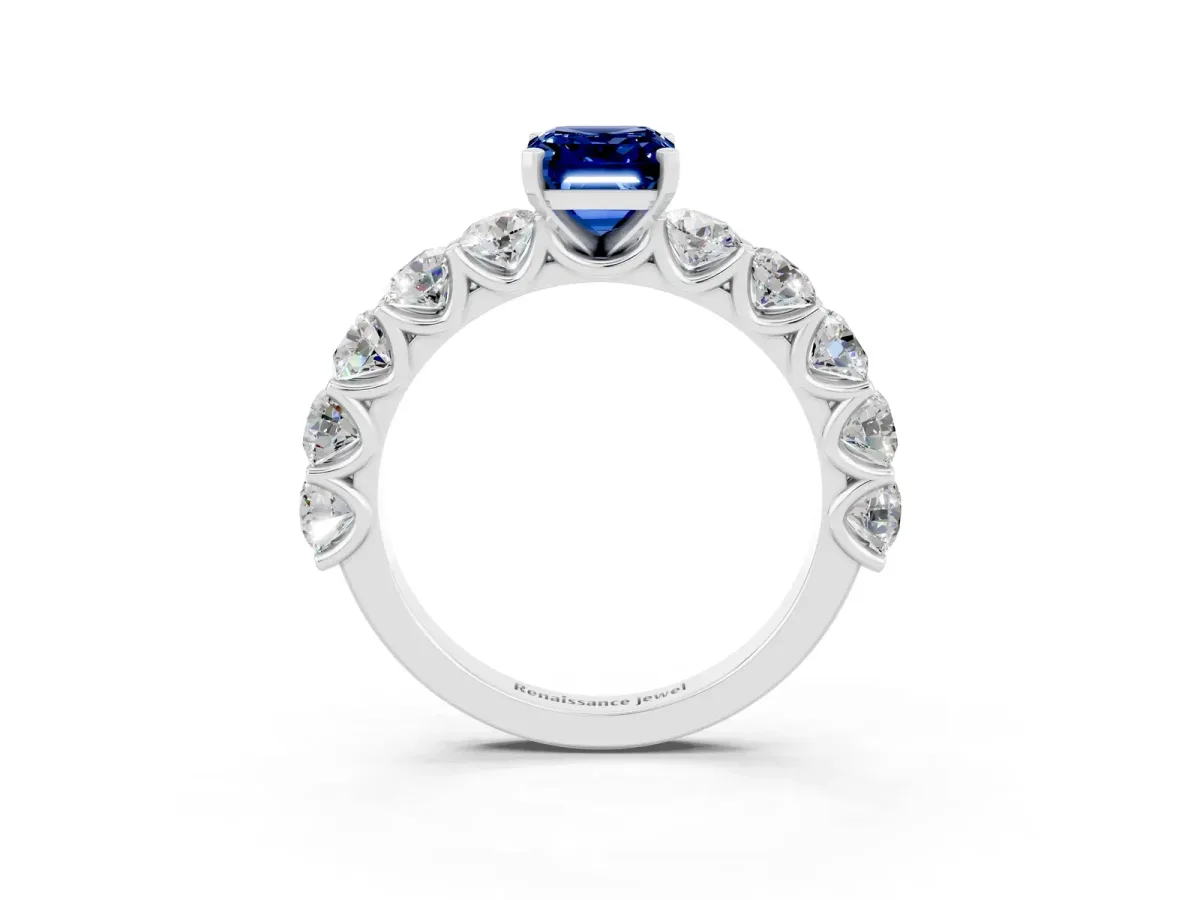 Emerald Cut Blue Sapphire Prong Setting with Side Stones on a Pave Band Platinum