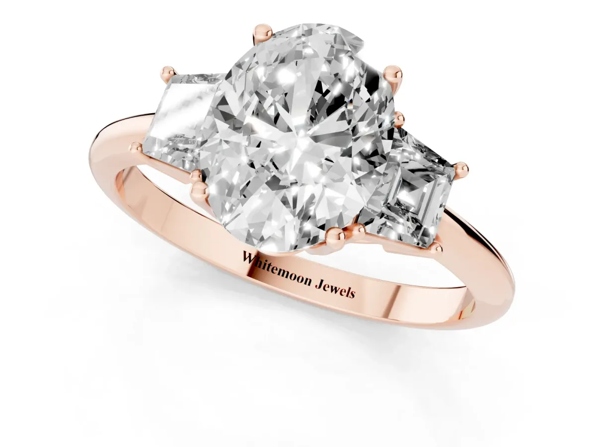 Oval Cut Diamond Three-Stone Ring with Trapezoid Side Stones and Prong Setting Rose gold