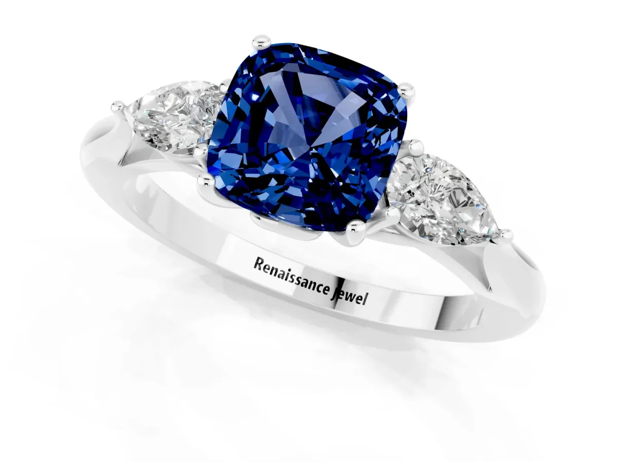 Three-Stone Cushion Cut Blue Sapphire Ring with Pear Side Stones in Four-Prong Setting White gold