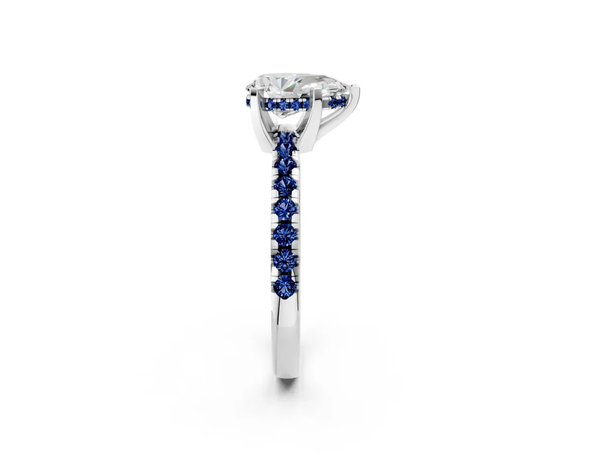 Pear Cut Diamond Solitaire Ring with Round Blue Sapphire Pavé Band and Four-Prong Setting Silver