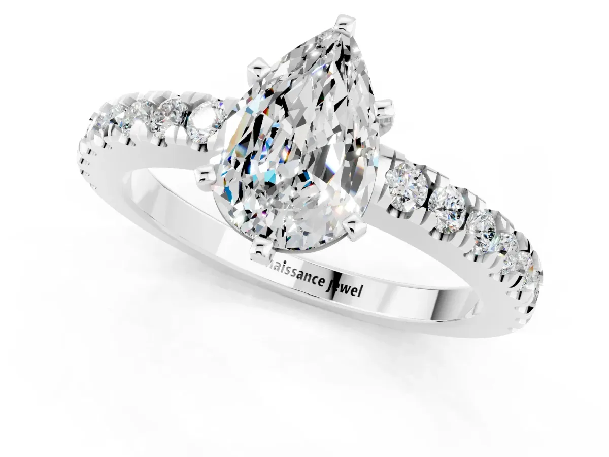 Pear Cut Solitaire Moissanite with Pavé Band and Four-Prong Setting Silver
