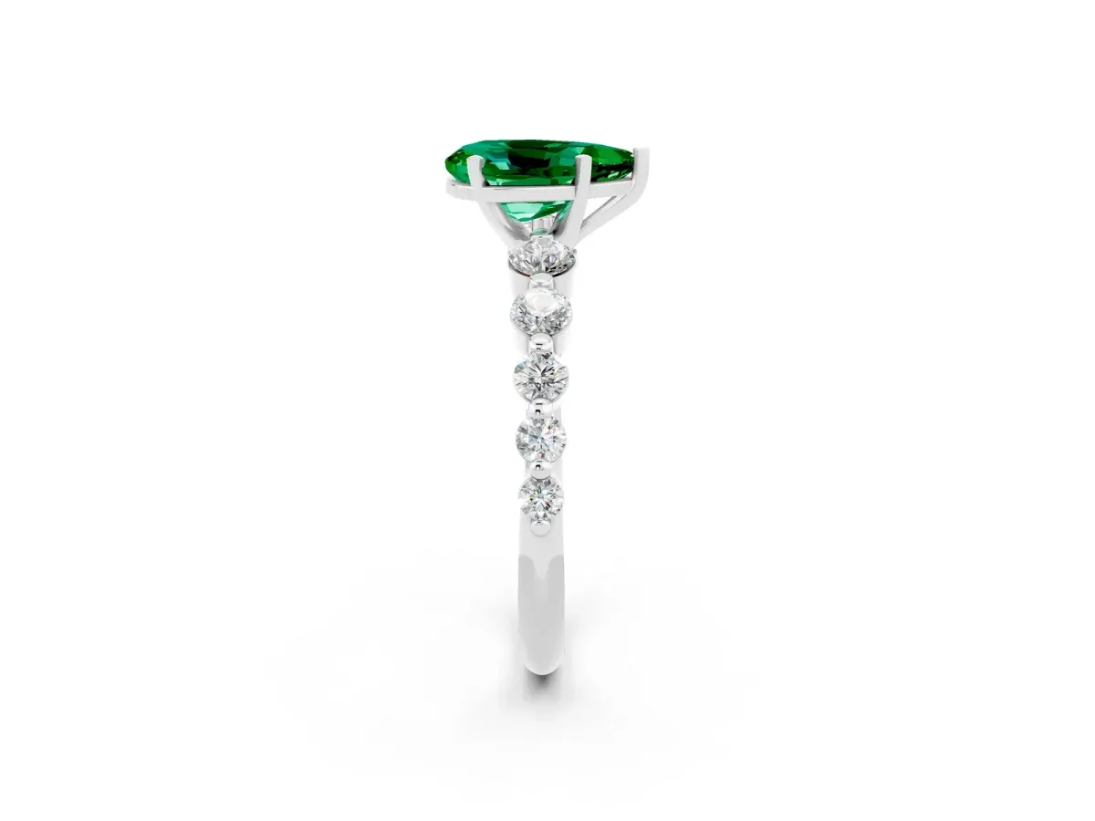 Pear Cut Solitaire Emerald Ring with Pave Band and Four-Prong Setting Silver