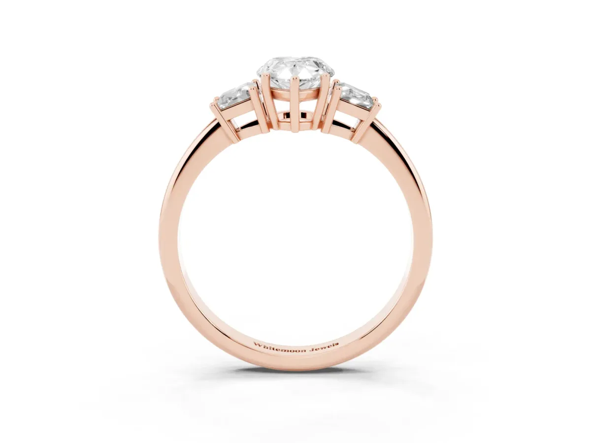 Pear Cut Diamond Three-Stone Ring with Trapezoid Side Stones and Prong Setting Rose gold