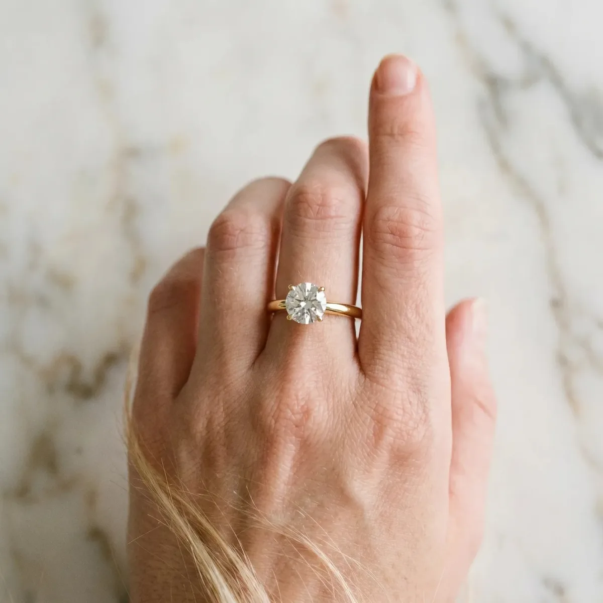 Round Cut Diamond Solitaire Ring with Classic Band and Four-Prong Setting Yellow gold