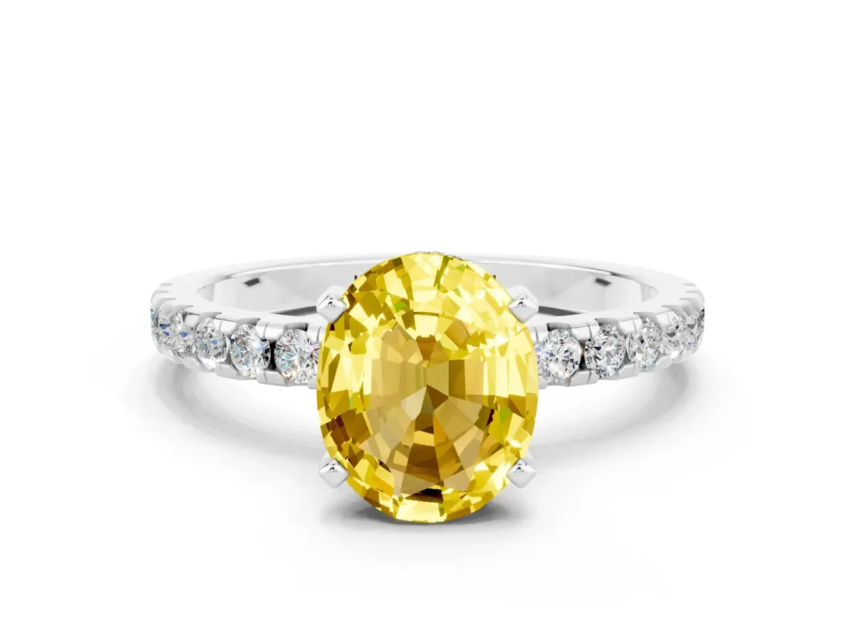 Oval Cut Yellow Sapphire Solitaire Ring with Round Pavé Band and Four-Prong Setting Silver