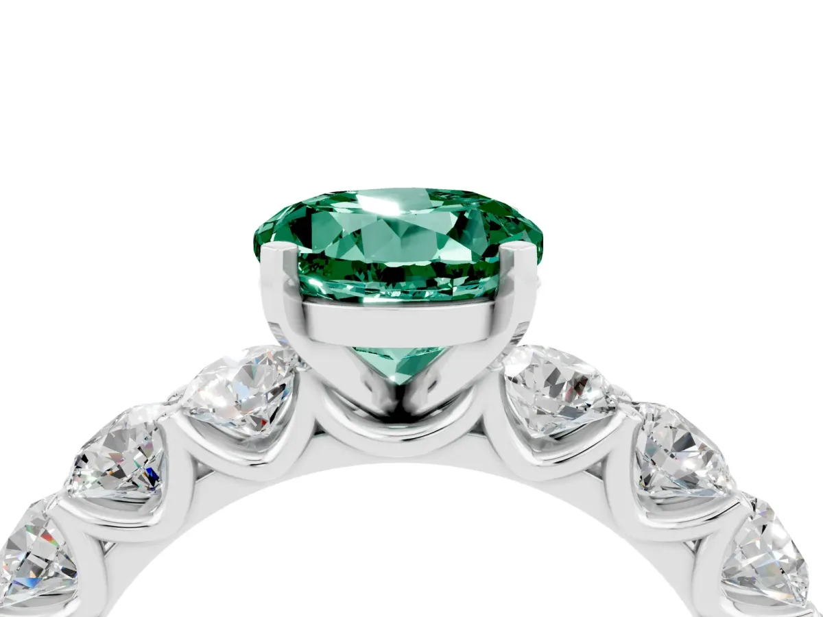 Round Cut Green Sapphire Prong Setting with Side Stones on a Pave Band Silver