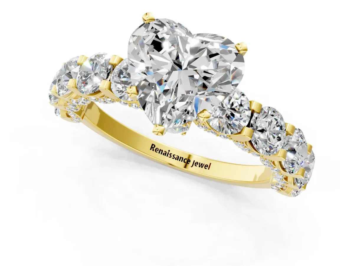 Heart Cut Diamond Side Stone Engagement Ring with Four-Prong Setting Yellow gold
