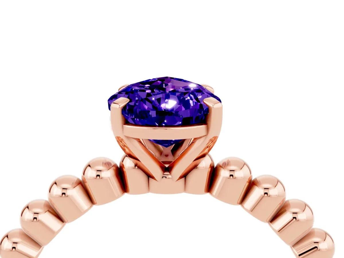 Pear Cut Tanzanite Solitaire Ring with Beaded Band and Prong Setting Rose gold