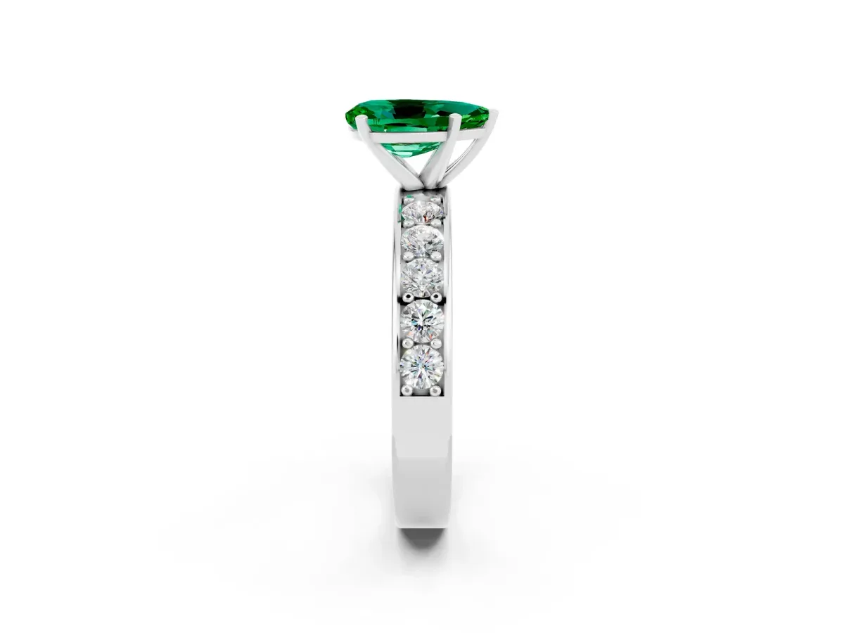 Pear Cut Emerald Engagement Ring with Channel Set Round Band and Prong Setting White gold