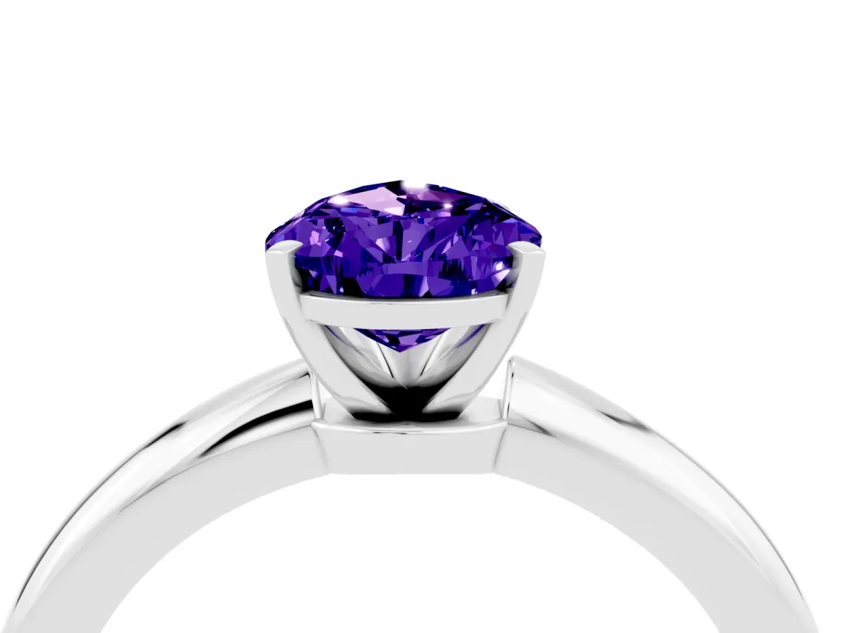 Pear Cut Tanzanite Solitaire Ring with Six-Prong Setting and Classic Band Silver