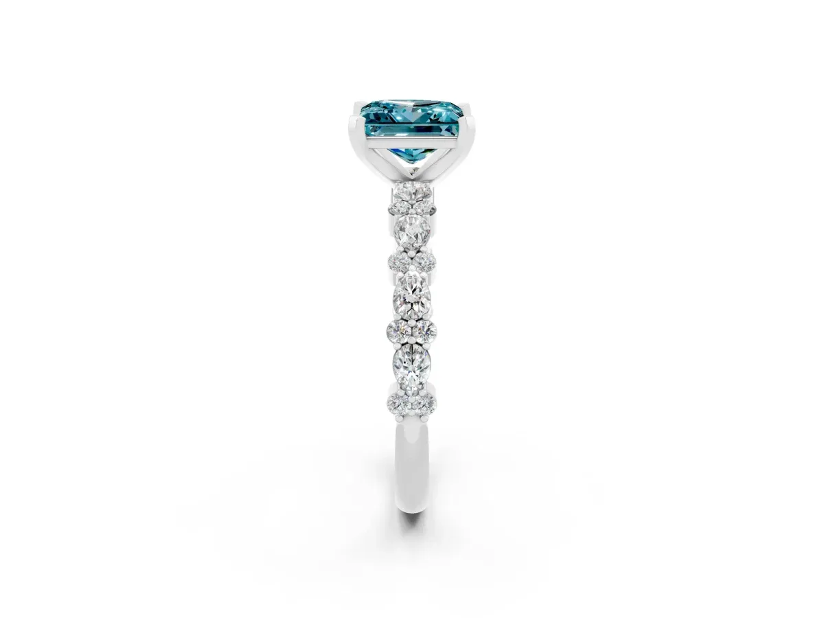 Princess Cut Blue Topaz Side Stone Solitaire Ring with Round and Four-Prong Setting Silver