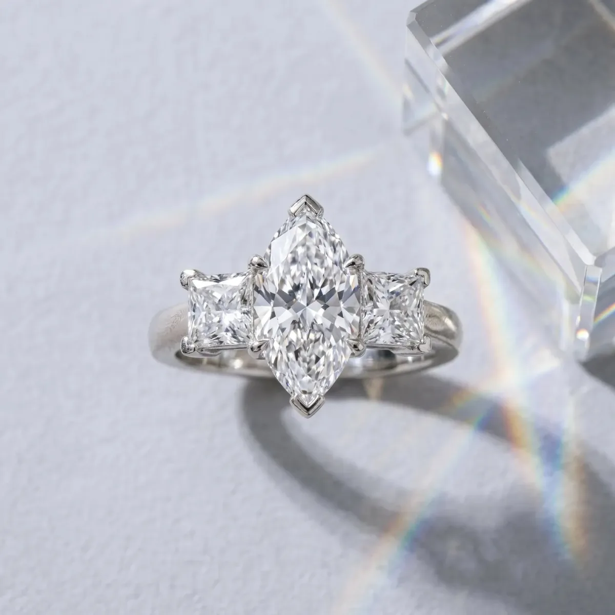 Three-Stone Marquise Cut Cut Diamond Ring with Channel Set Band and Four-Prong Setting Platinum