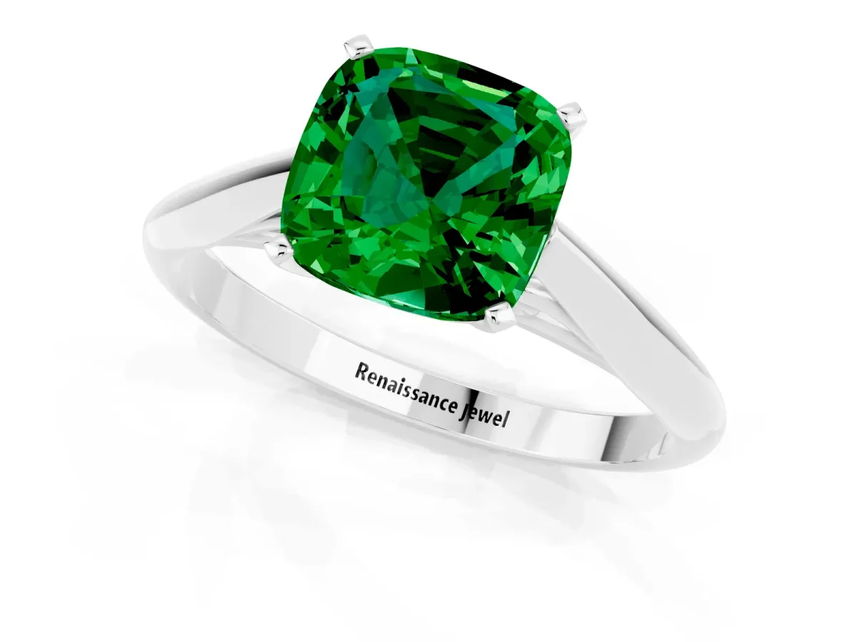 Cushion Cut Emerald Solitaire Engagement Ring with Cathedral Setting and Four-Prong Mount White gold