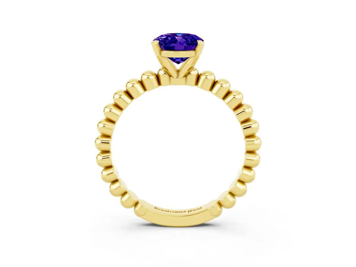 Oval Cut Tanzanite Solitaire Ring with Beaded Band and Prong Setting Yellow gold