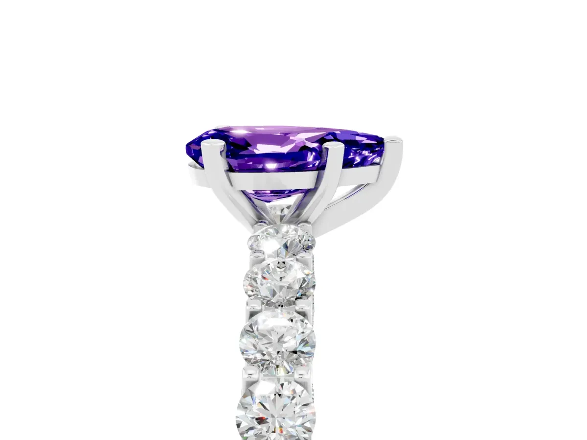 Pear Cut Tanzanite Solitaire Ring with Shared Prong Pavé Band and Four-Prong Setting Silver