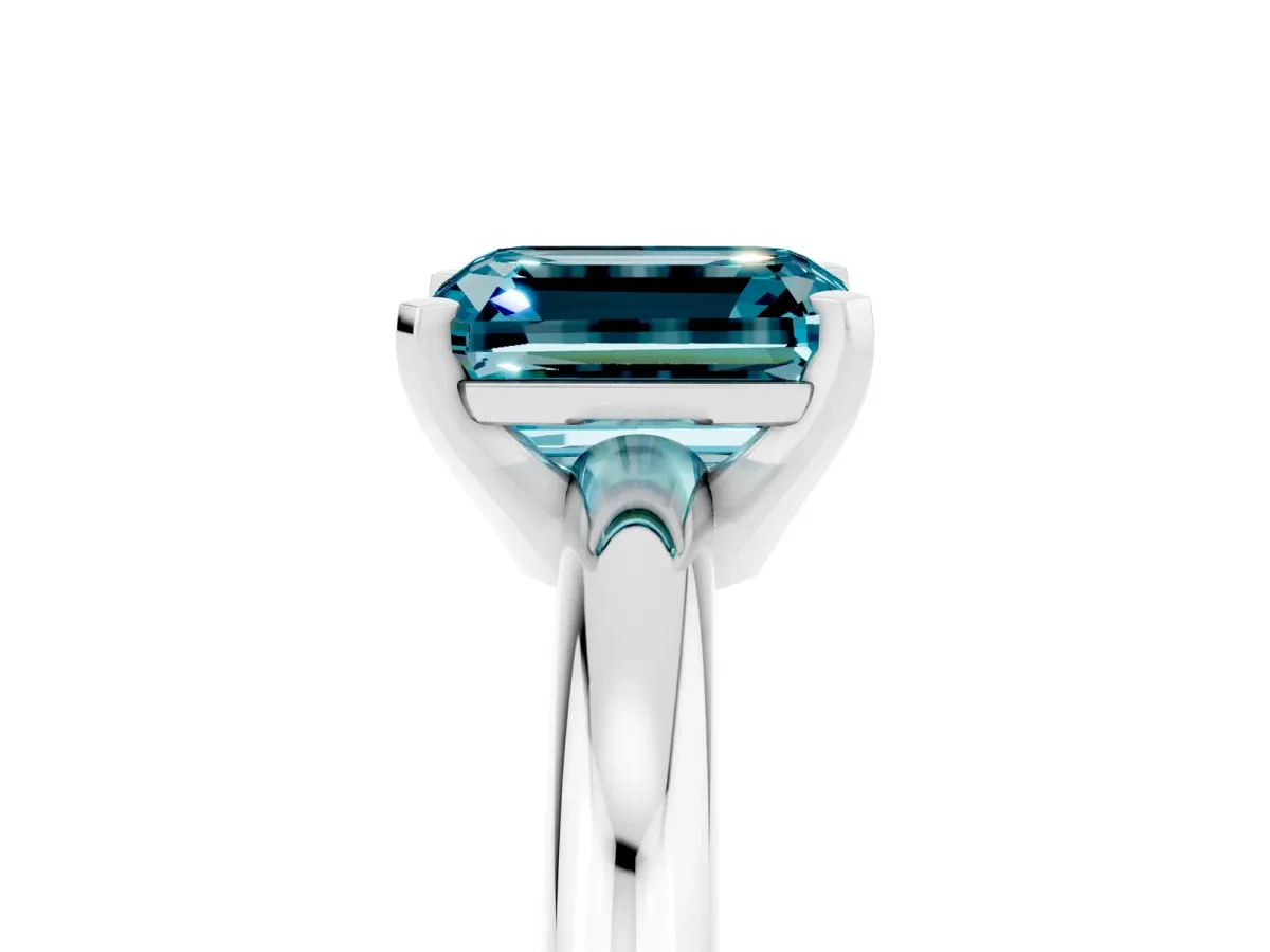 Emerald Cut Blue Topaz Solitaire Engagement Ring with Round Band and Four-Prong Setting Silver