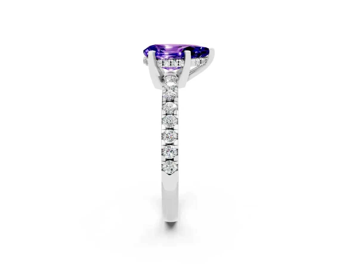 Pear Cut Tanzanite Solitaire Ring with Round Pavé Band and Four-Prong Setting Silver