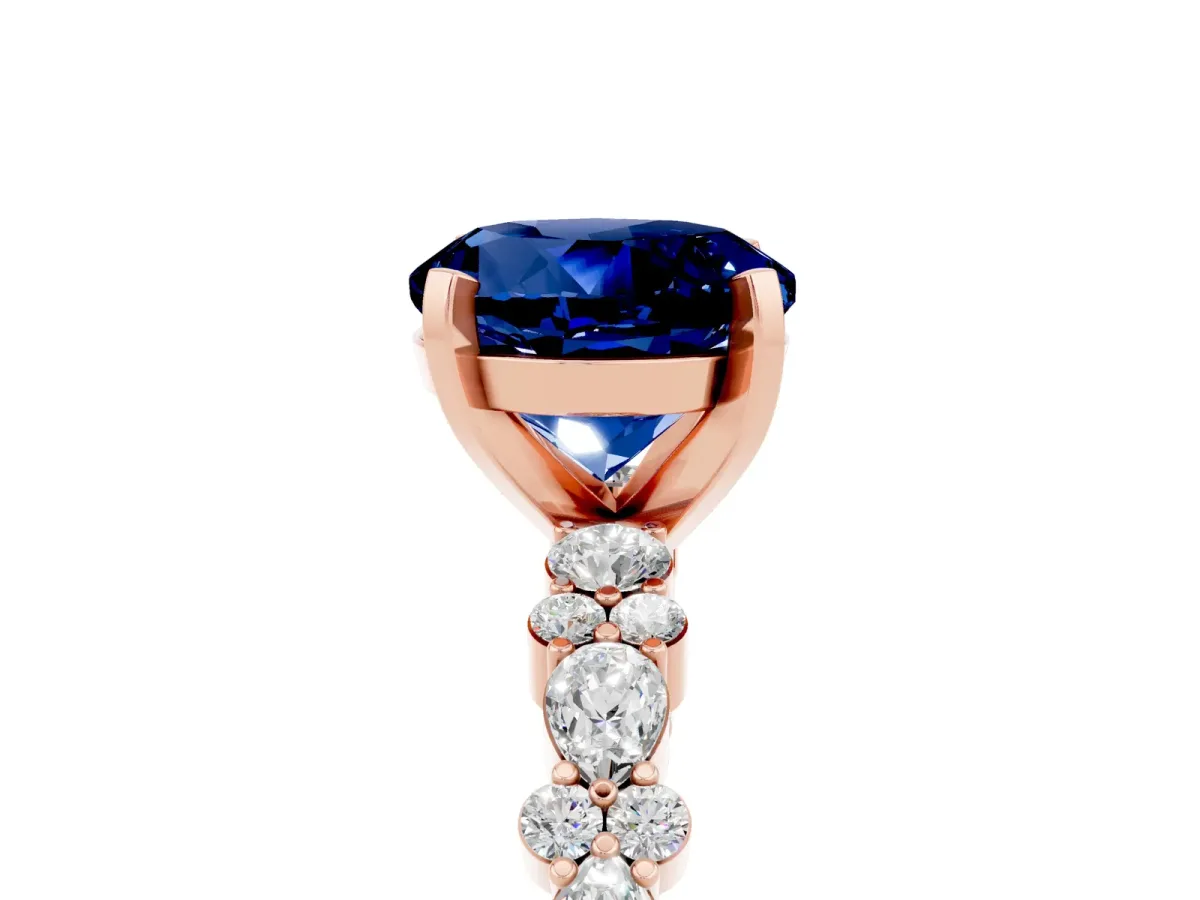 Round Cut Blue Sapphire Side Stone Solitaire Ring with Round and Four-Prong Setting Rose gold