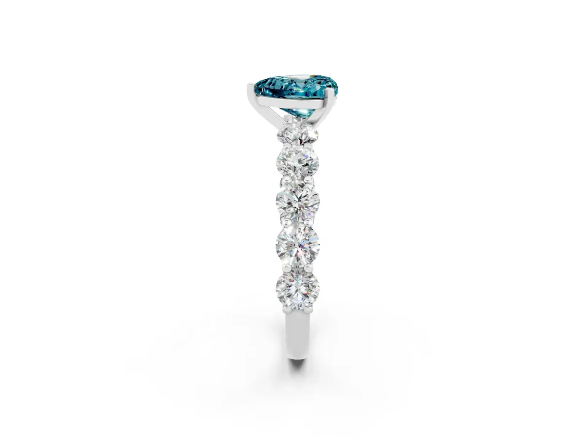 Heart Cut Blue Topaz Prong Setting with Side Stones on a Pave Band Silver